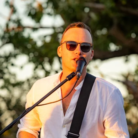 ShenFM performing live with electric guitar